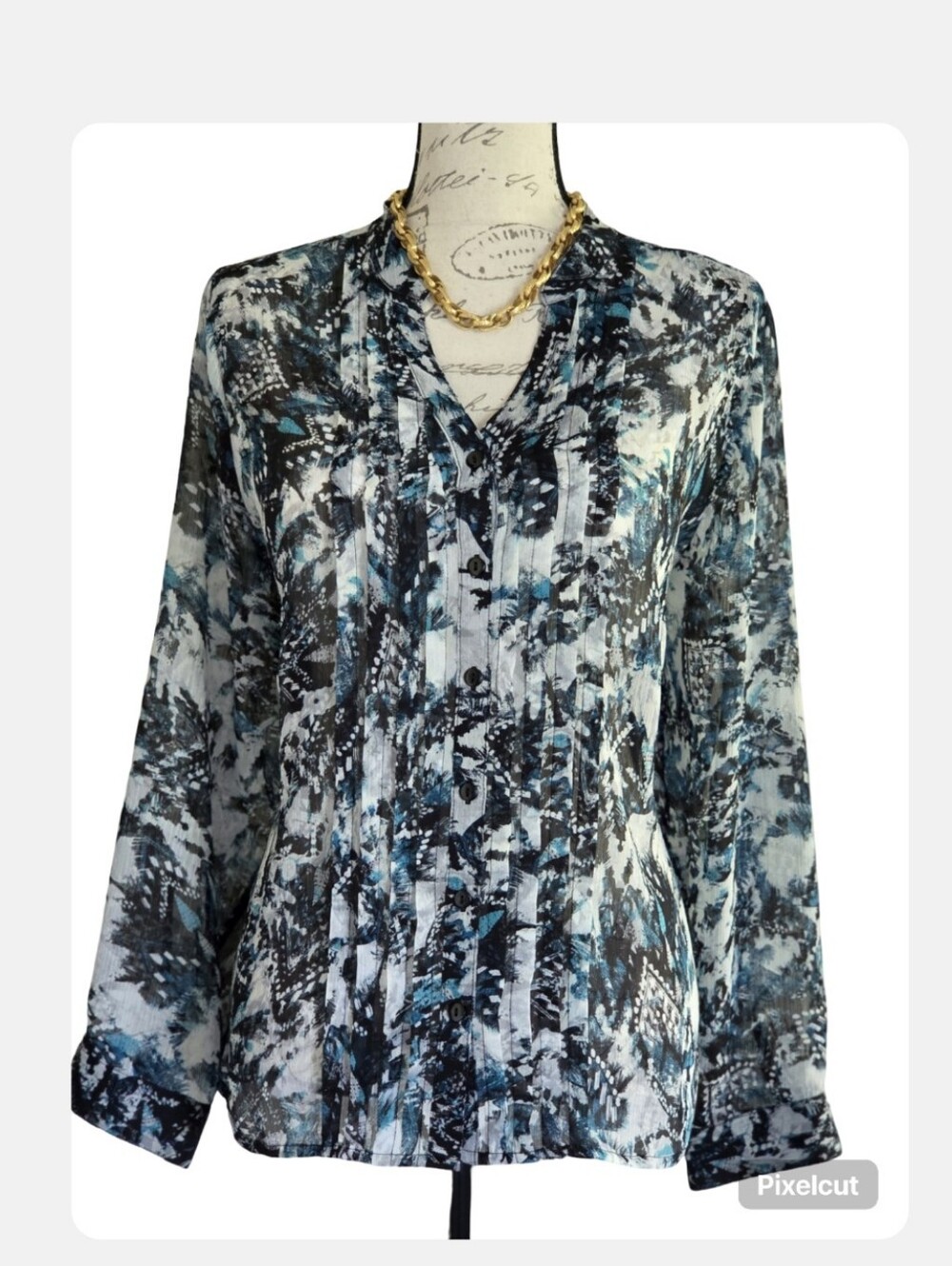 Sheer long sleeved blouse.